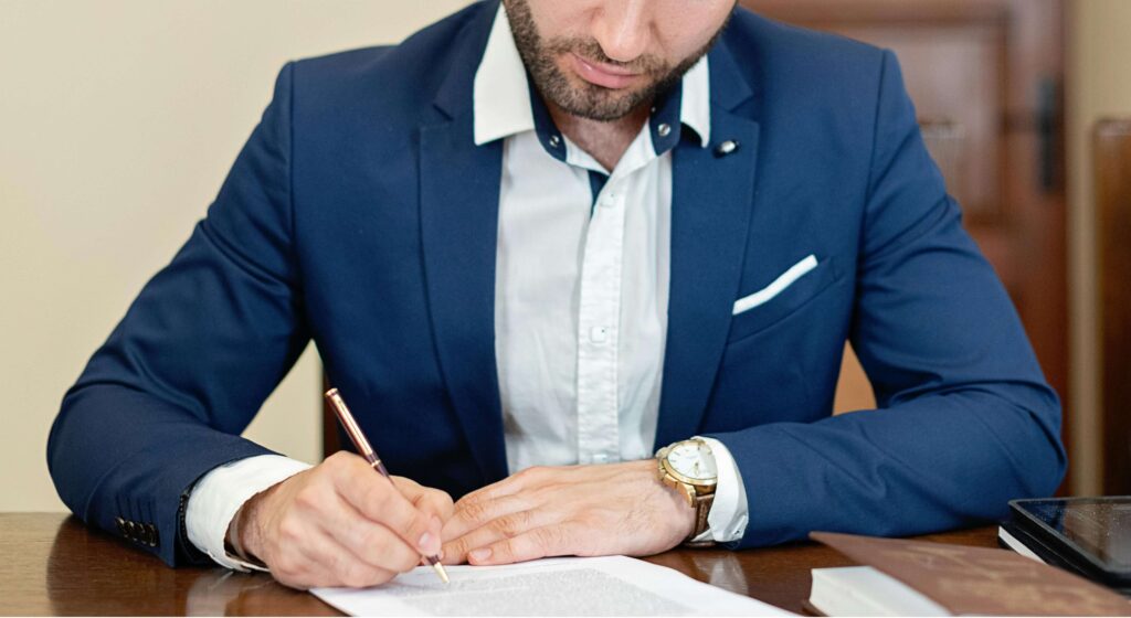 Image of a businessman signing documents at work. Sometimes, even overachievers struggle with cheating. Discover the benefits of infidelity counseling in Delray Beach, FL, for those who feel disconnected in relationships.