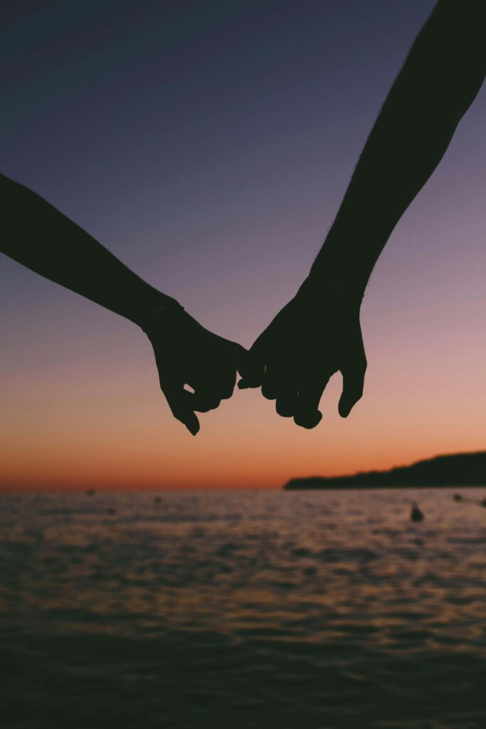 Photo of a couple holding hands at sunset. Do you and your partner struggle with reconciliation? Working with a relationship therapist in Delray Beach, FL, can help you navigate conflict in a meaningful way. 