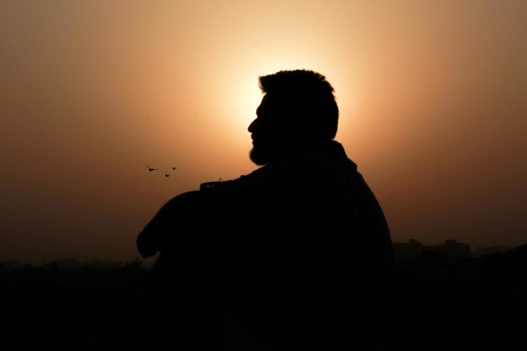 Silhouette of a man thinking at sunset. Family conflict can make us feel distraught, but a family therapist in Delray Beach, FL, can help you achieve open communication and mutual understanding through relationship therapy. 