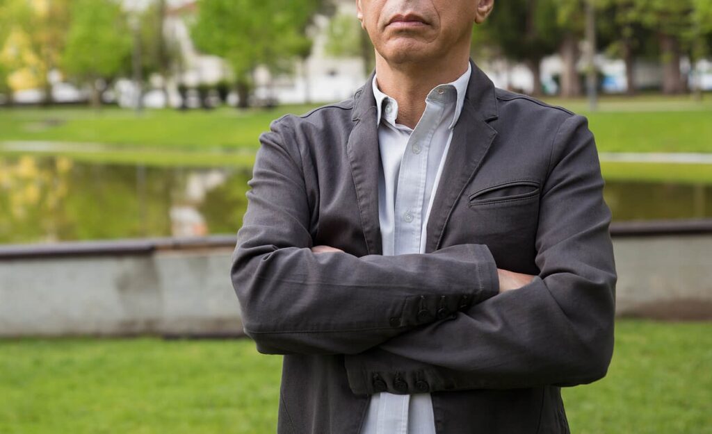 Photo of a man with his arm folded in frustration. Are you tired of dealing with a toxic friend? Therapy for relationship issues in Delray Beach, FL, can help you end the frustration and move forward with confidence. 