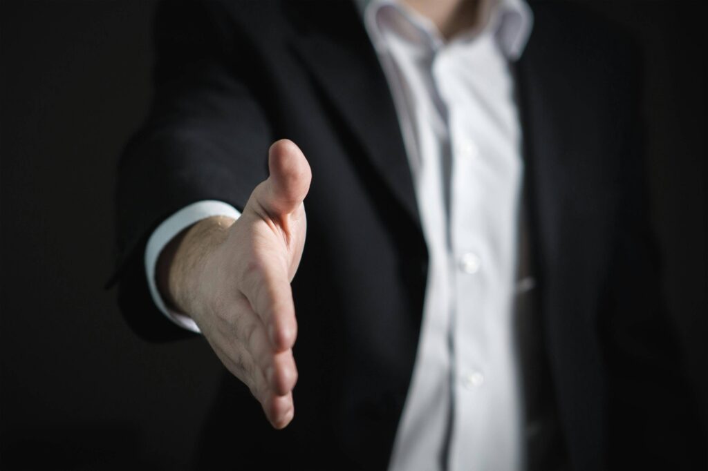 Picture of a man's hand reaching out for a handshake. Are you wondering if its possible to reach a truce in a toxic relationship?  Get helpful guidance and support through relationship therapy in Delray Beach, FL. 