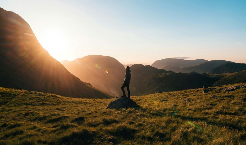 Photo of a man looking up at a sunrise over a mountainous landscape. Is your job harming your mental health? Hope is on the horizon. Work with an experienced relationship therapist in Delray Beach, FL. 
