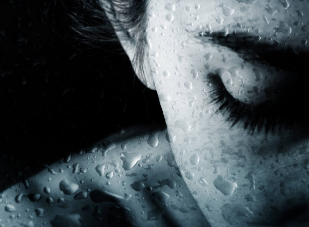 Photo of a sad woman with raindrops on her skin. Is your partner's toxic behavior affecting your sense of self-worth? Relationship therapy in Delray Beach, FL, can guide you on how to move forward. 