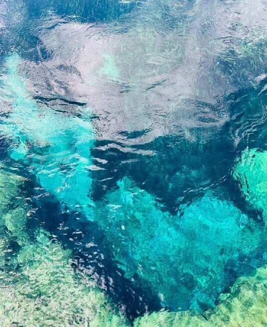 Clear blue water showing deep reflections and lighter turquoise patches. Vulnerability and relationships often bring hidden fears to the surface. A relationship therapist in Delray Beach, FL, can help you explore these feelings safely.