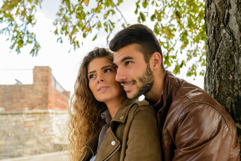 Picture of a couple sitting next to each other outside. Open and honest communication is the bedrock of any happy marriage. Learn how to keep communication strong through relationship counseling in Delray Beach, FL.