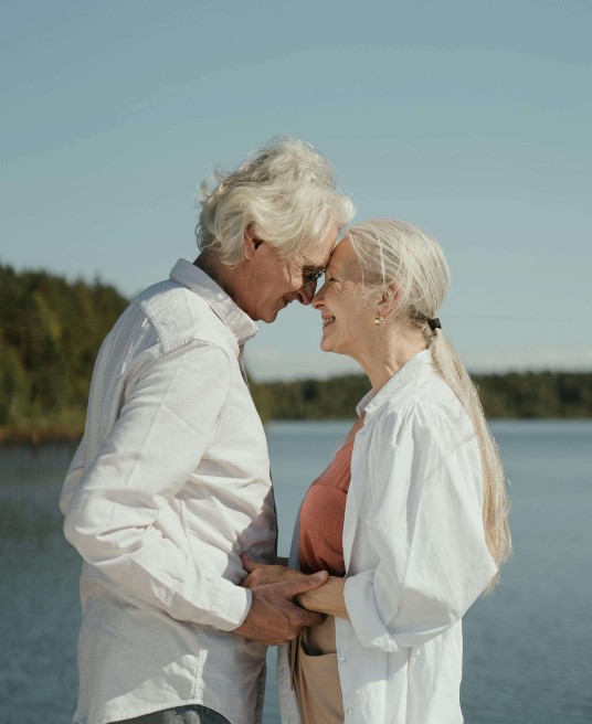 Picture of a smiling older couple embracing each other. Are you wondering how to have a happy marriage? An experienced couples and relationship therapist in Delray Beach, FL, can offer tips for a thriving future.
