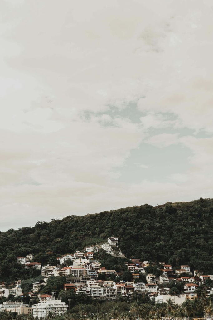 Picture of houses in a small town along a mountainside. Are you struggling to feel grounded after moving away from a small town? Therapy for relationship issues in Delray Beach, FL, can help you maintain healthy connections to your new surroundings. 