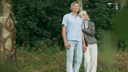 An elderly couple stands close, leaning on each other in the forest. Therapy for relationship issues can help couples build resilience and closeness. A relationship therapist in Delray Beach, FL, supports healthier patterns for long-term love.