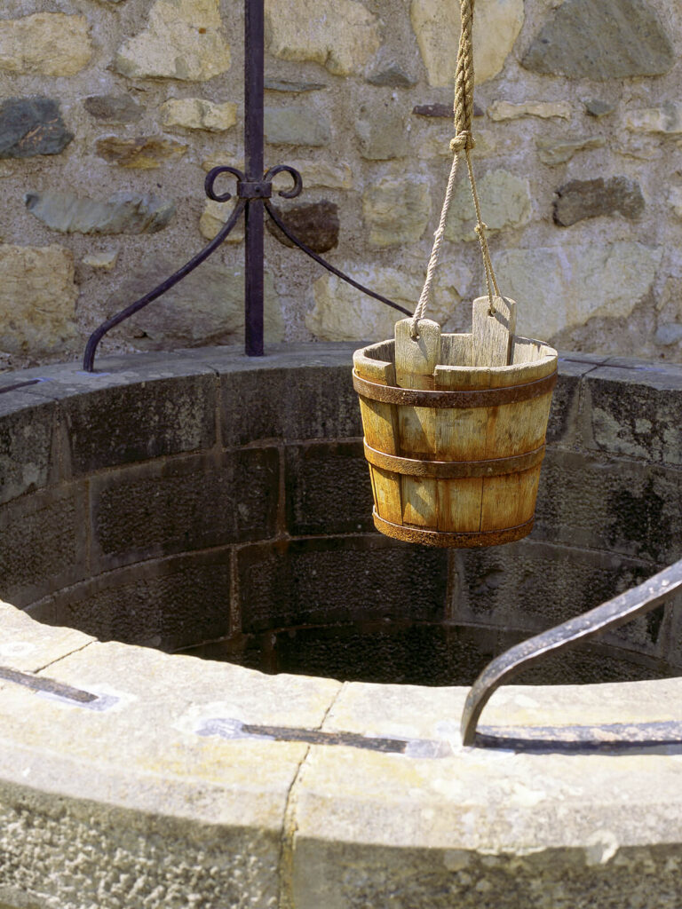Photo of a bucket hovering above a stone water well.  Much like going to a dry well when you're thirsty, going back home isn't always the answer to loneliness. Get professional guidance from a relationship therapist in Delray Beach, FL. 