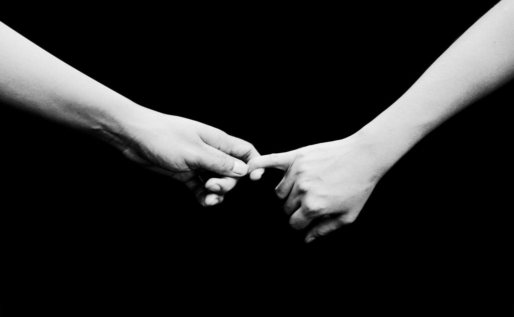 Hands reaching | relationship power dynamics delray beach | relationship counseling | imbalance of power in a relationship | Highland Beach | Juno Beach | Loxahatchee Two hands reach out and lightly touch against a black background. Power in a relationship can shift quietly over time. Working with a relationship therapist in Delray Beach, FL, helps partners rebuild trust, communication, and emotional equality.