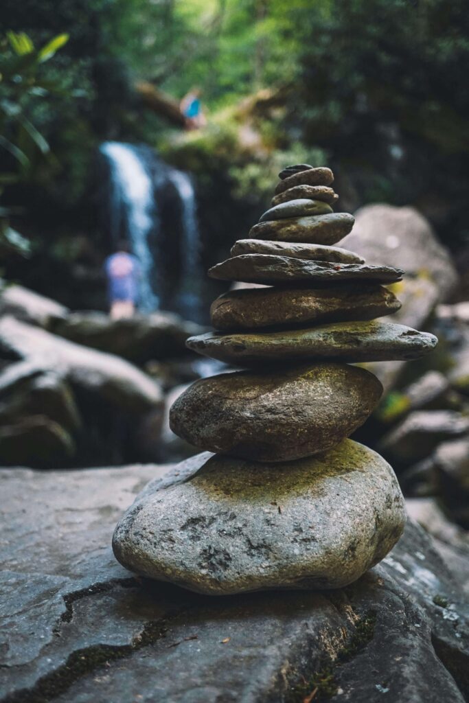 Waterfall stones | am i the problem in my relationship delray beach | relationship counseling | relationship fading love | Highland Beach | Juno Beach | Loxahatchee Stacked stones balanced near a soft waterfall in nature. Marriage problems can feel unstable, but balance is possible. A relationship therapist in Delray Beach, FL, can guide couples in restoring trust and understanding through mindful therapy.