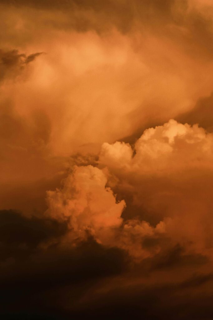 Golden clouds filling the sky, capturing both the heaviness and beauty of navigating anxiety in romantic relationships. Building trust and calm takes work. A relationship therapist in Delray Beach, FL, helps couples find emotional balance.