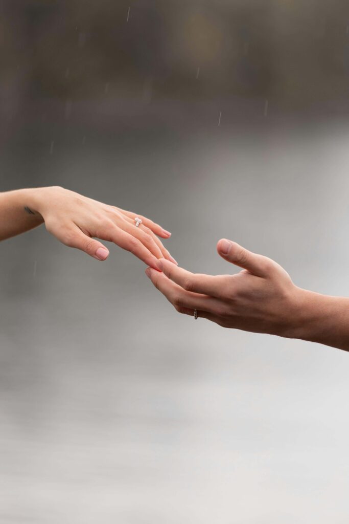 Two hands reach toward each other. When anxiety and depression isolate you, can reaching out help? An anxiety therapist in Delray Beach, FL, understands how these conditions feed each other and offers integrated support.