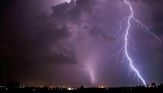 Lightning striking ground in front of a purple sunset. Are panic attacks making you feel on edge? An anxiety therapist in Delray Beach, FL, can help you identify your triggers and develop a plan to overcome panic and anxiety.