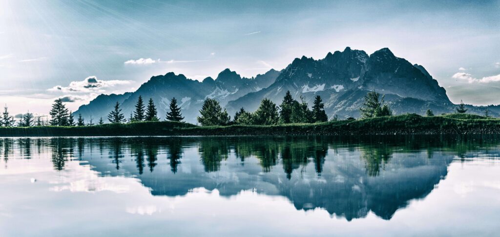 A mountain range reflects in the still, mirror-like surface of a calm alpine lake. Perfectionism can drive high achievers to relentlessly pursue an impossible standard of flawlessness. Anxiety therapy in Delray Beach, FL can help you find balance and self-compassion instead.