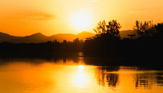 A vivid orange sunset casts a warm glow over a still lake. Can stepping away from toxic family dynamics help quiet the anxiety that has followed you for years? Anxiety therapy in Delray Beach, FL can support you in building a calmer, healthier life.