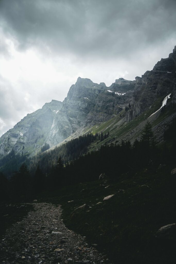 A rugged mountain peak rises above a dark forest beneath a stormy, overcast sky. Can severe anxiety cast a shadow over even the most ordinary parts of daily life? An anxiety therapist in Delray Beach, FL can help lift that weight.