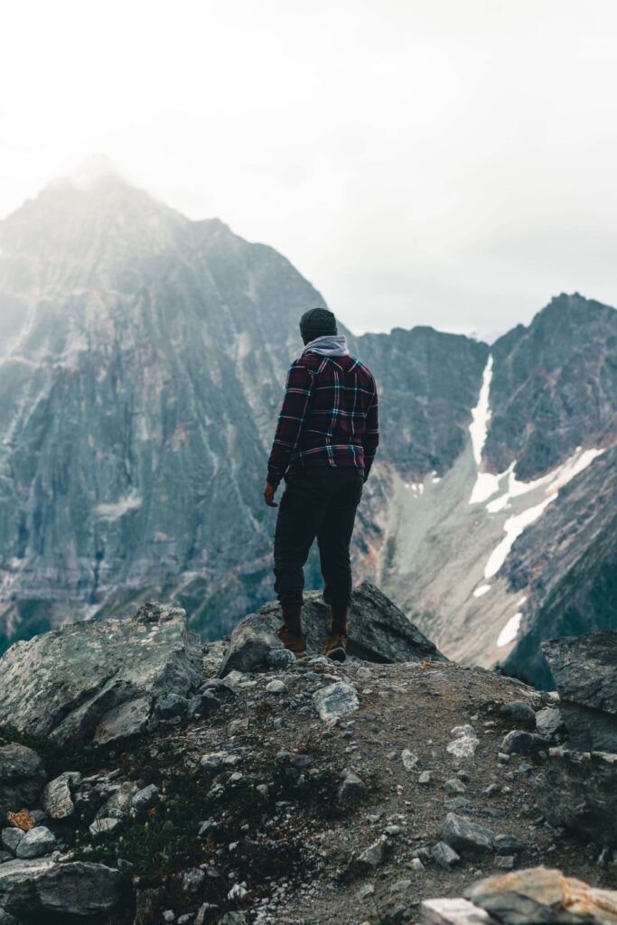 A man stands on a rocky ridge, taking in the view of the surrounding mountain peaks. What does severe anxiety actually look like when it starts affecting how someone shows up in life? Anxiety therapy in Delray Beach, FL offers support in recognizing and managing those signs.