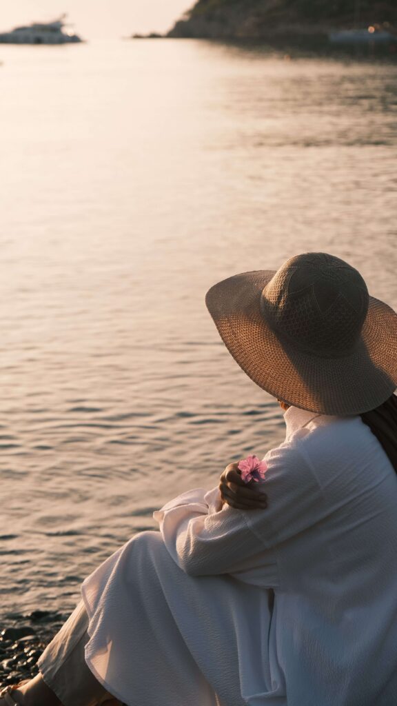 Wide-brimmed hat | delray beach anxiety treatment | chronic anxiety | anxiety therapy davis | Delray Beach, Florida | High Point | Boca Raton | Palm Beach Gardens A woman wearing a wide-brimmed hat sits quietly beside the water at sunset. How can understanding anxiety or stress help explain persistent emotional distress? An anxiety therapist in Delray Beach, FL, can provide guidance and support.